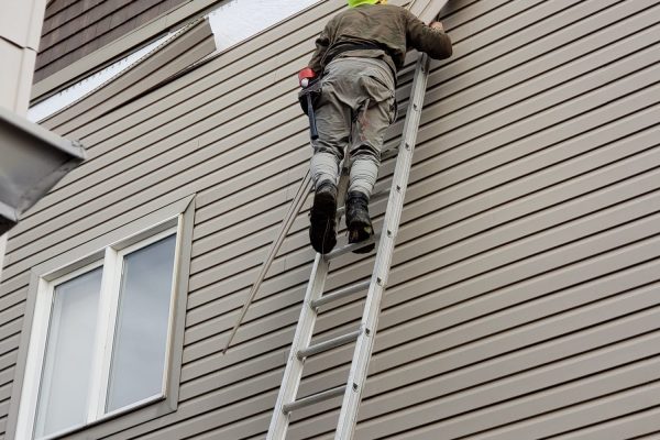 Tacupro employee remodeling wooden structures of a house during professional home renovation